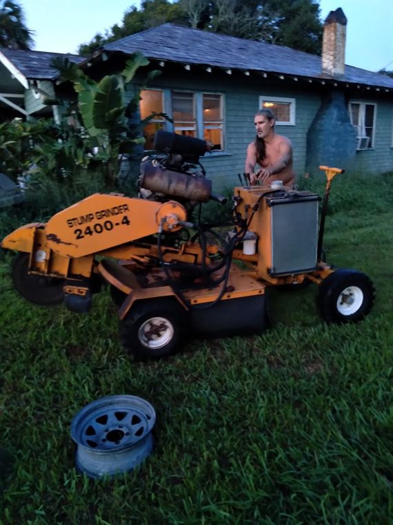 Bill with the stump grinder at the end of a job.